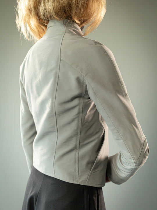 Close up of grey jacket, showing texture of the fabric