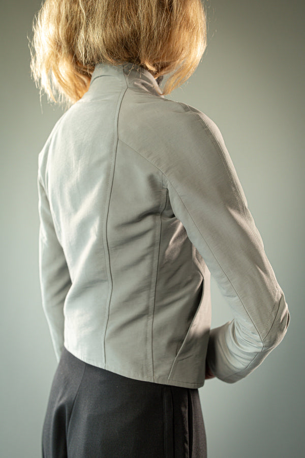 Close up of grey jacket, showing texture of the fabric