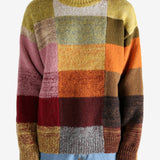 Yellow sweater worn by a person, showing the sweater's fit