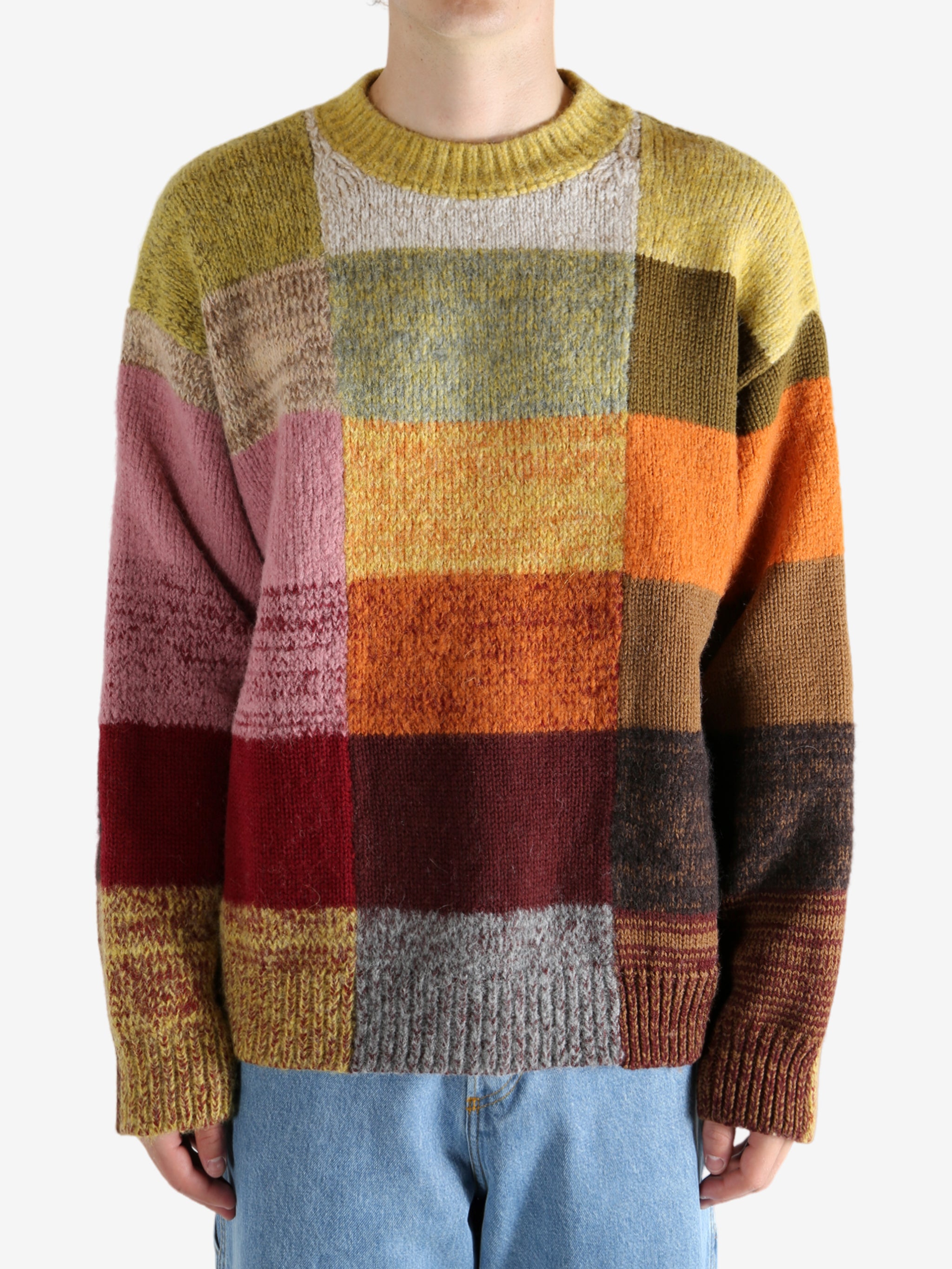 Yellow sweater worn by a person, showing the sweater's fit