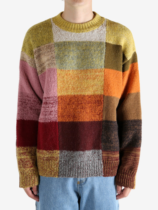 Yellow sweater worn by a person, showing the sweater's fit