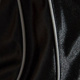 Close up of black tops, showing texture of the polyester fabric