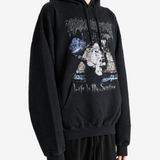 Black hoodie worn by a person, showing the hoodie fit