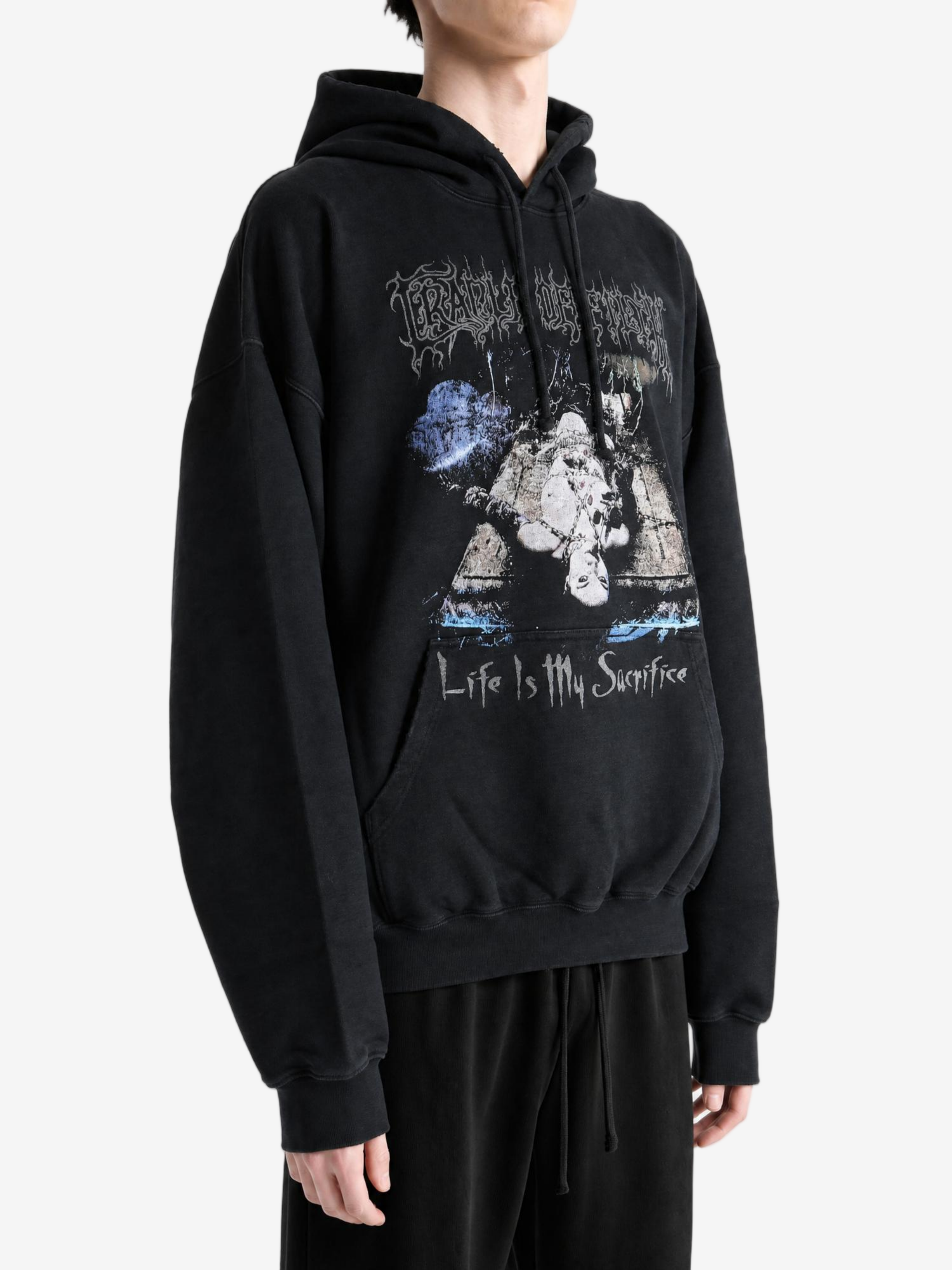 Black hoodie worn by a person, showing the hoodie fit