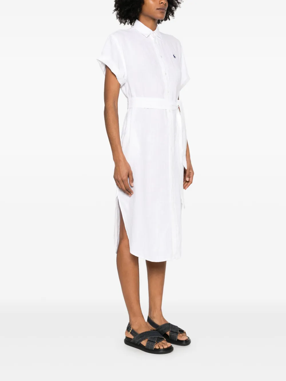 White dress worn by a person, showing the dress's fit