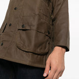 Brown jacket worn by a person, showing the jacket fit