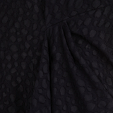 Close up of Black dress, showing texture of the 100% virgin wool made fabric