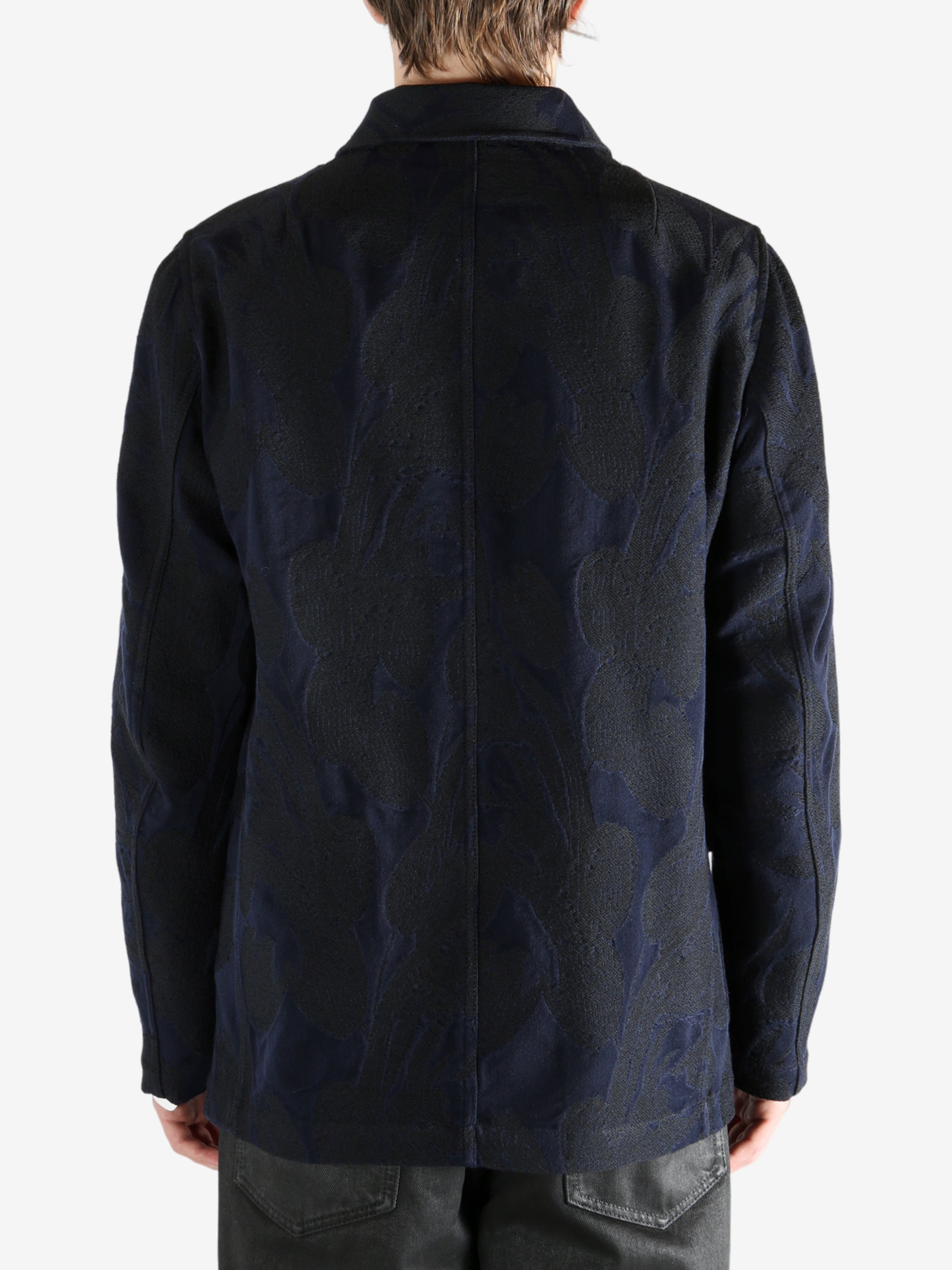 Navy jacket worn by a person, showing the jacket's fit