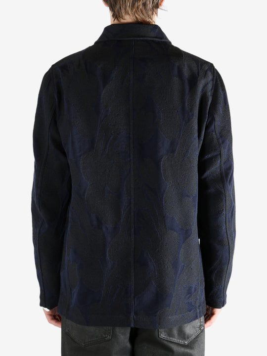 Navy jacket worn by a person, showing the jacket's fit