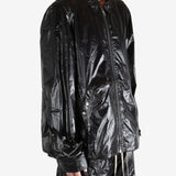 Black jacket worn by a person, showing the jacket's fit