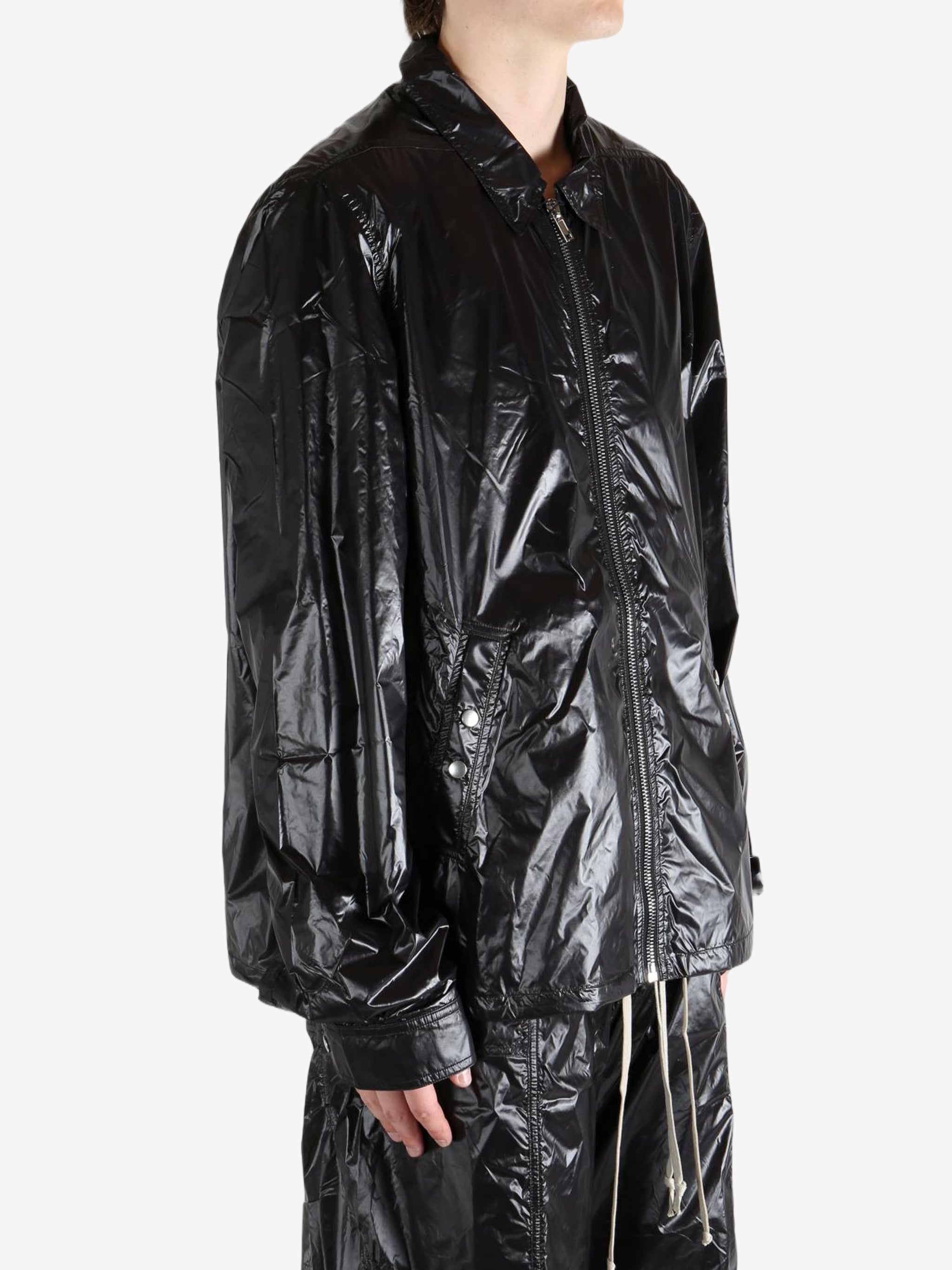 Black jacket worn by a person, showing the jacket's fit