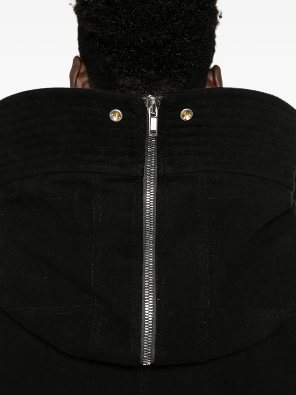 Black jacket worn by a person, showing the jacket fit