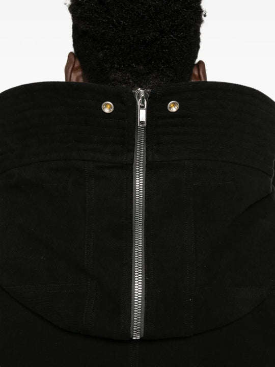 Black jacket worn by a person, showing the jacket fit