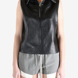 Black top worn by a person, showing the top's fit