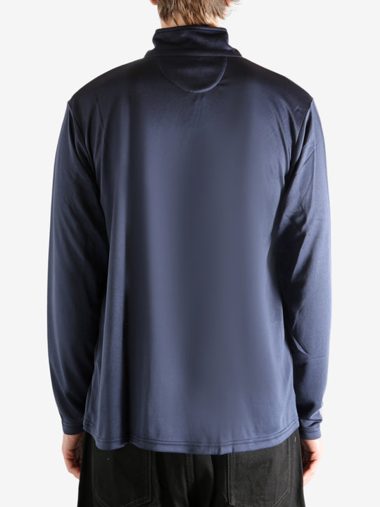 Navy pullover worn by a person, showing the pullover's fit