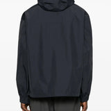 Black jacket worn by a person, showing the jacket's fit