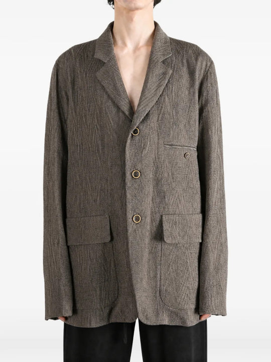 Grey jacket worn by a person, showing the jacket fit