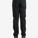 Black pants worn by a person, showing the pants's fit