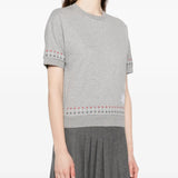 Grey t-shirt worn by a person, showing the t-shirt's fit