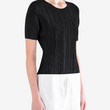 Black shirt worn by a person, showing the shirt fit