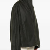 Green jacket worn by a person, showing the jacket fit