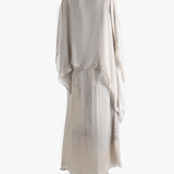 Silver dress worn by a person, showing the loose fit.