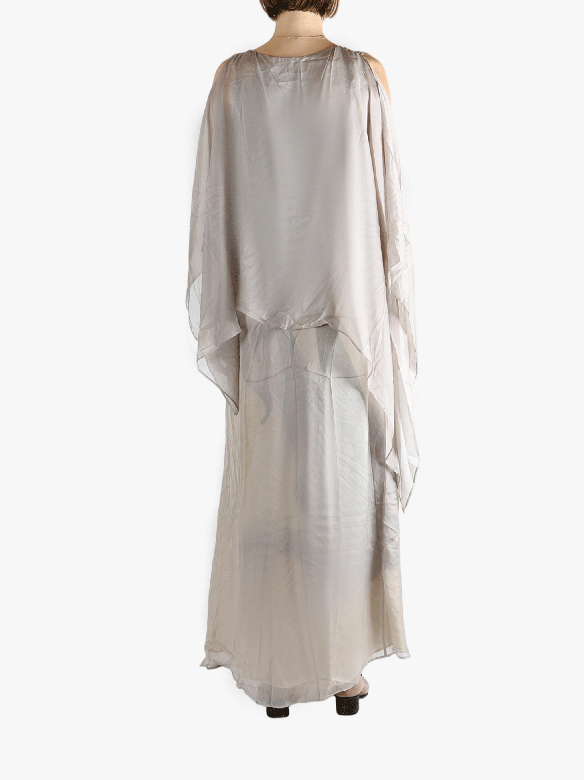 Silver dress worn by a person, showing the loose fit.