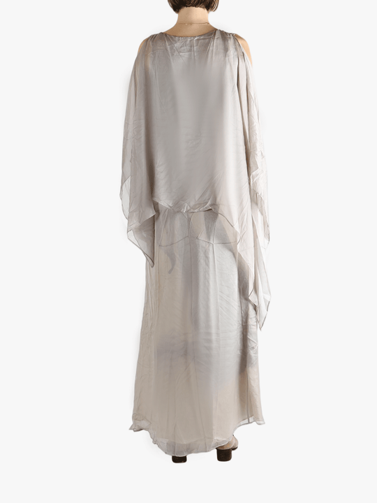 Silver dress worn by a person, showing the loose fit.