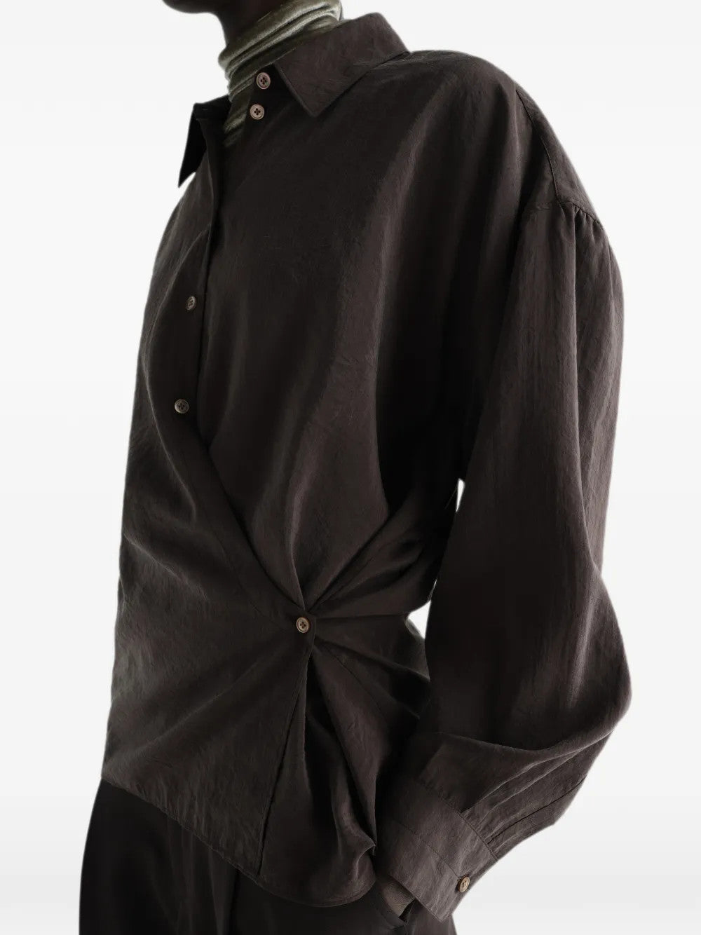 Brown shirt worn by a person, showing the shirt fit
