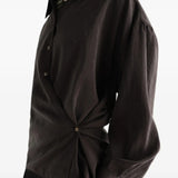 Brown shirt worn by a person, showing the shirt fit