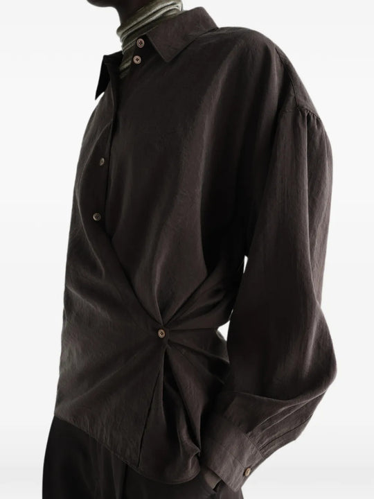 Brown shirt worn by a person, showing the shirt fit