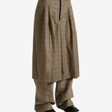 Brown pants worn by a person, showing the pants' fit