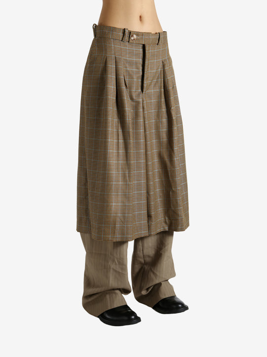 Brown pants worn by a person, showing the pants' fit