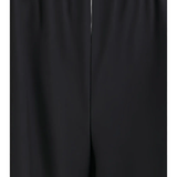 Close up of black pants, showing texture of the virgin wool fabric