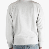 Grey jacket worn by a person, showing the jacket fit