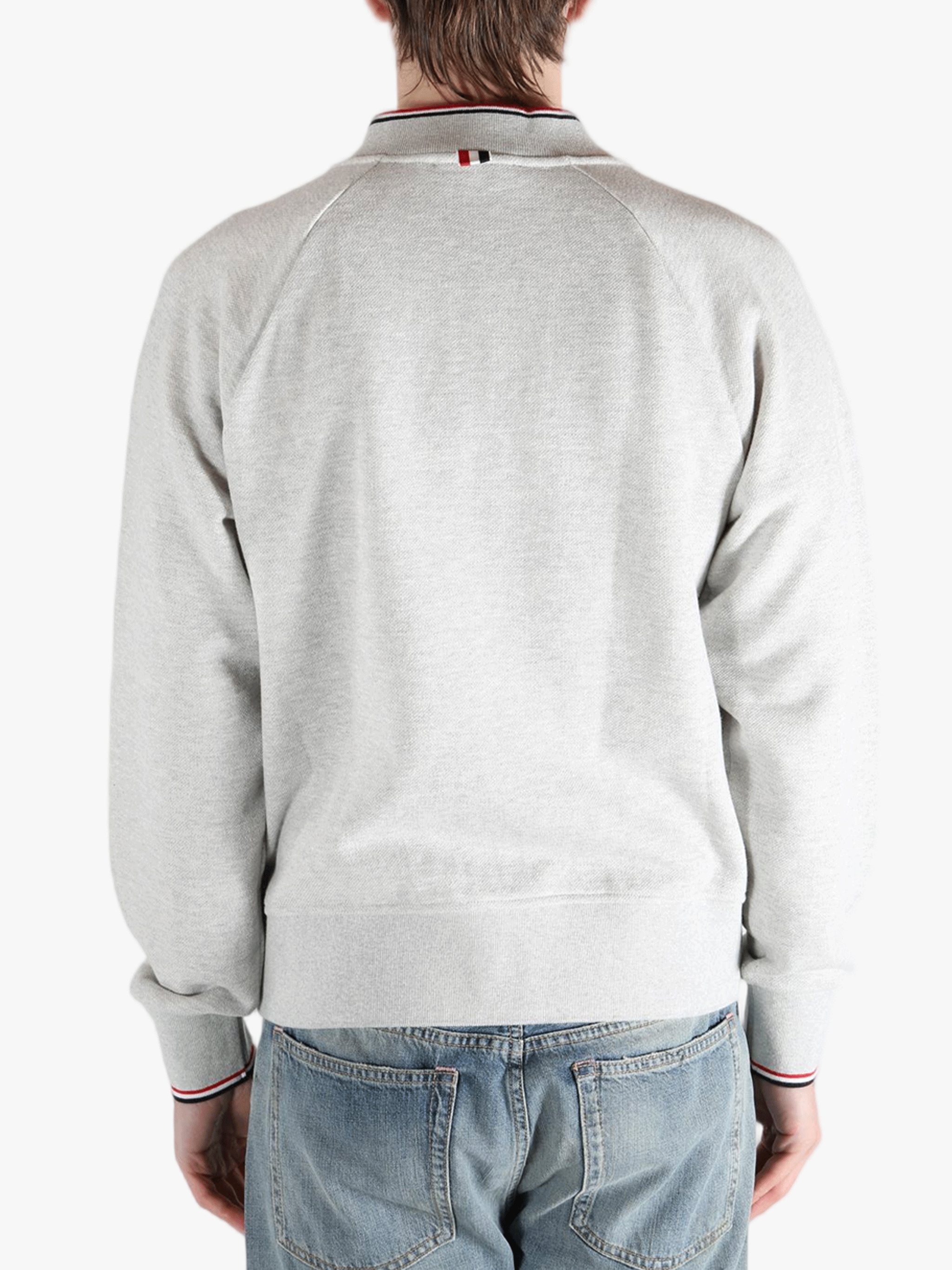 Grey jacket worn by a person, showing the jacket fit