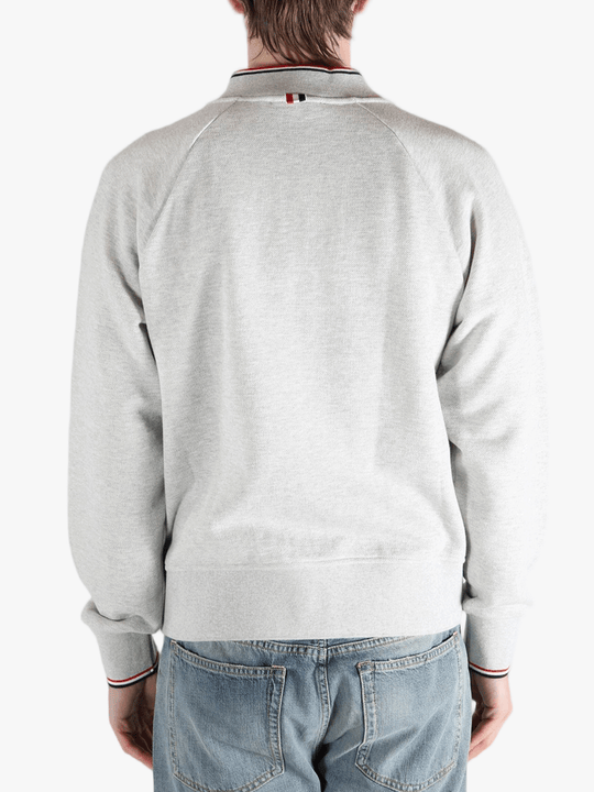 Grey jacket worn by a person, showing the jacket fit