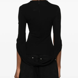 black t-shirt worn by a person, showing the t-shirt fit