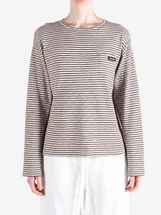 Brown knitwear worn by a person, showing the knitwear fit