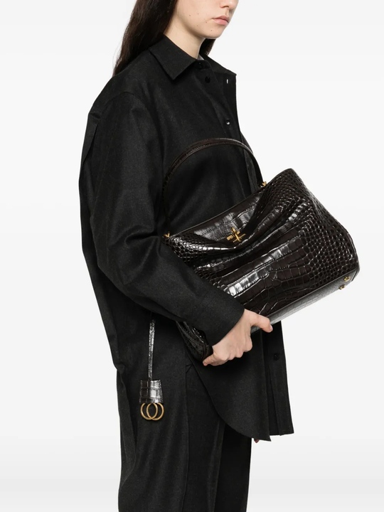 Black bag worn by a person, showing the bag's fit