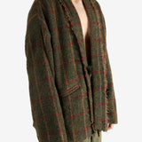 Green jacket worn by a person, showing the jacket's fit