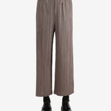 Brown pants worn by a person, showing the pants' fit