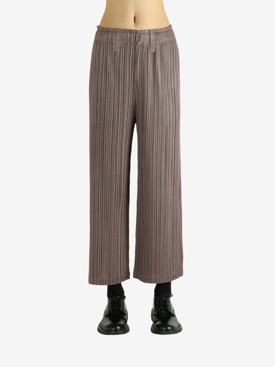 Brown pants worn by a person, showing the pants' fit