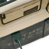 Close up of the green bag, showing texture of the leather fabric