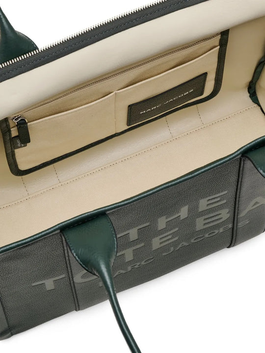 Close up of the green bag, showing texture of the leather fabric