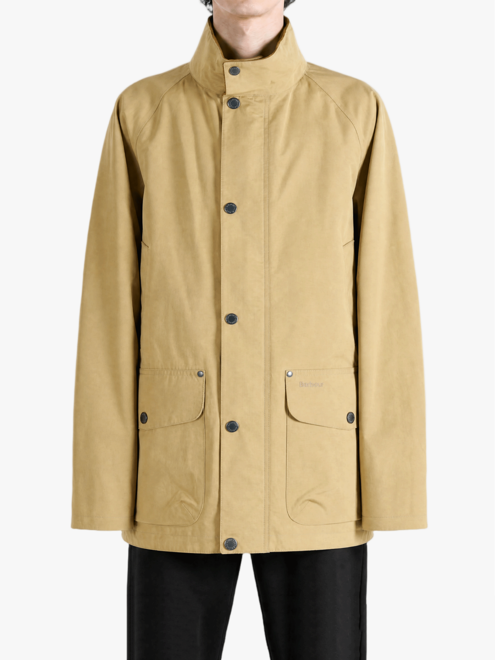 Tan jacket worn by a person, showing the jacket fit