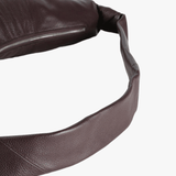 Close up of brown bag, showing the texture of leather details