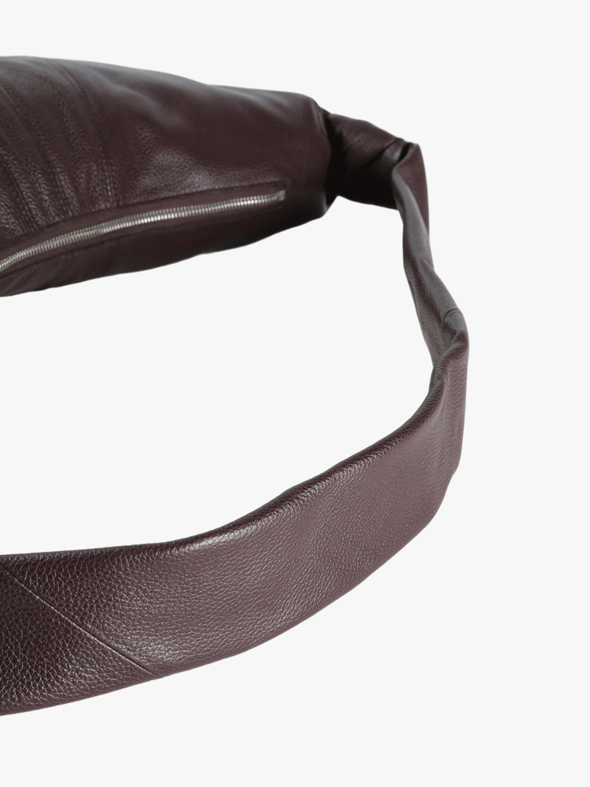 Close up of brown bag, showing the texture of leather details