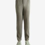 Grey pants worn by a person, showing the pants' fit