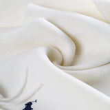 Close up of white scarves, showing texture of the recycled wool and wool fabric